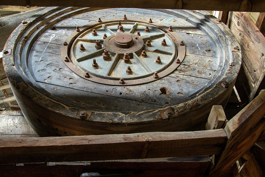 Wooden machinery wheel Photograph by Karen Foley