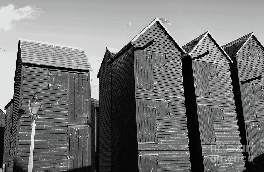 Wooden net huts in Hastings Photograph by David Fowler
