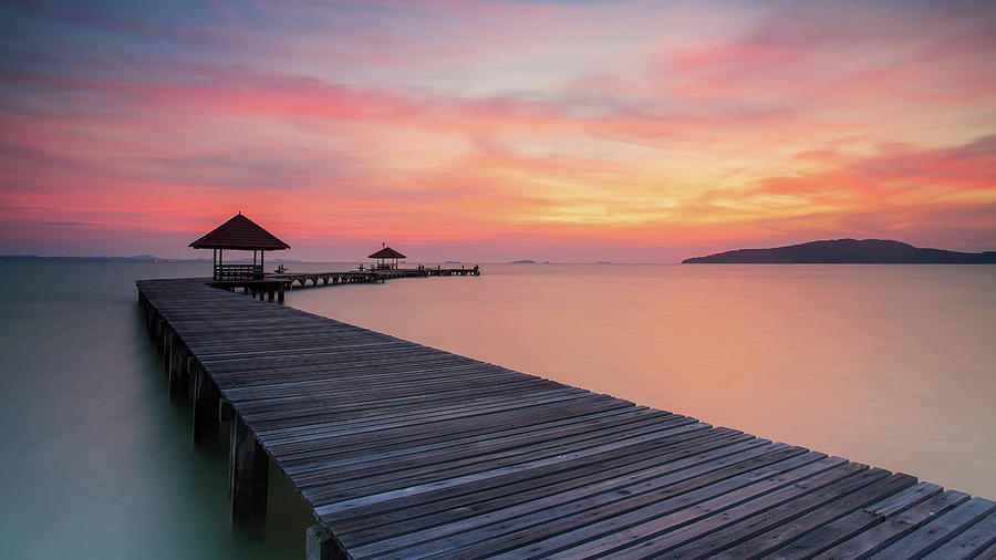 Wooden pier between sunset in Phuket Photograph by Anek Suwannaphoom