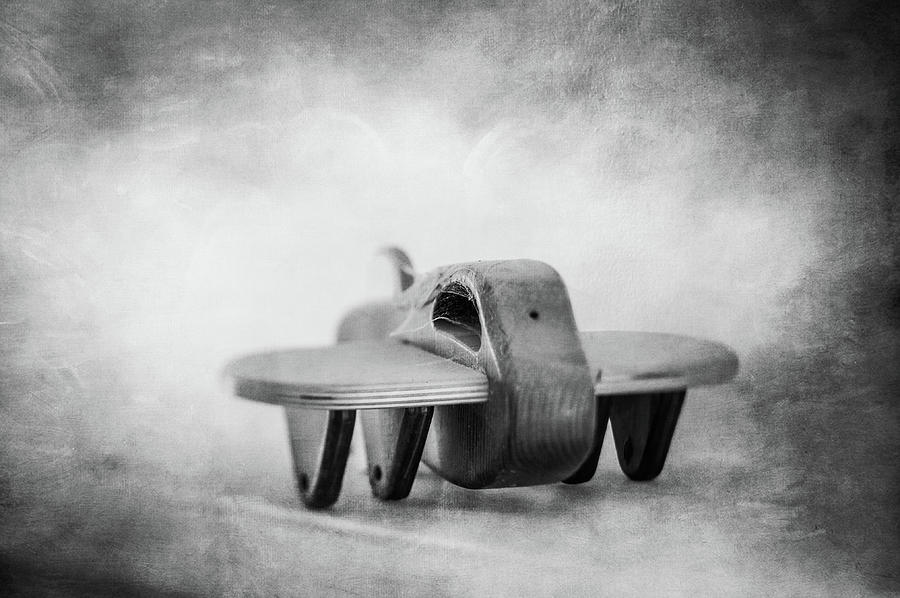 Wooden Toy Airplane On Fireplace Mantel In Bw Photograph