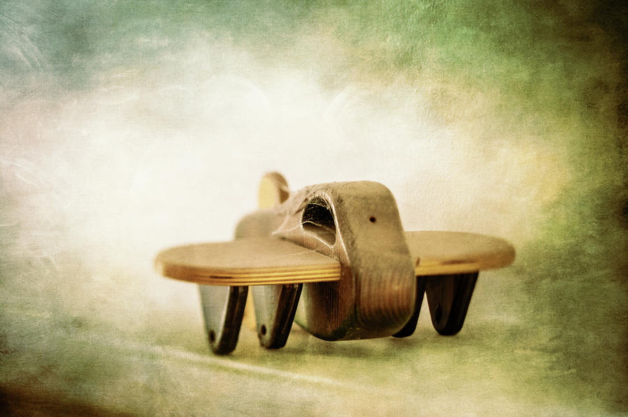 Wooden Toy Airplane on Fireplace Mantel Photograph by YoPedro