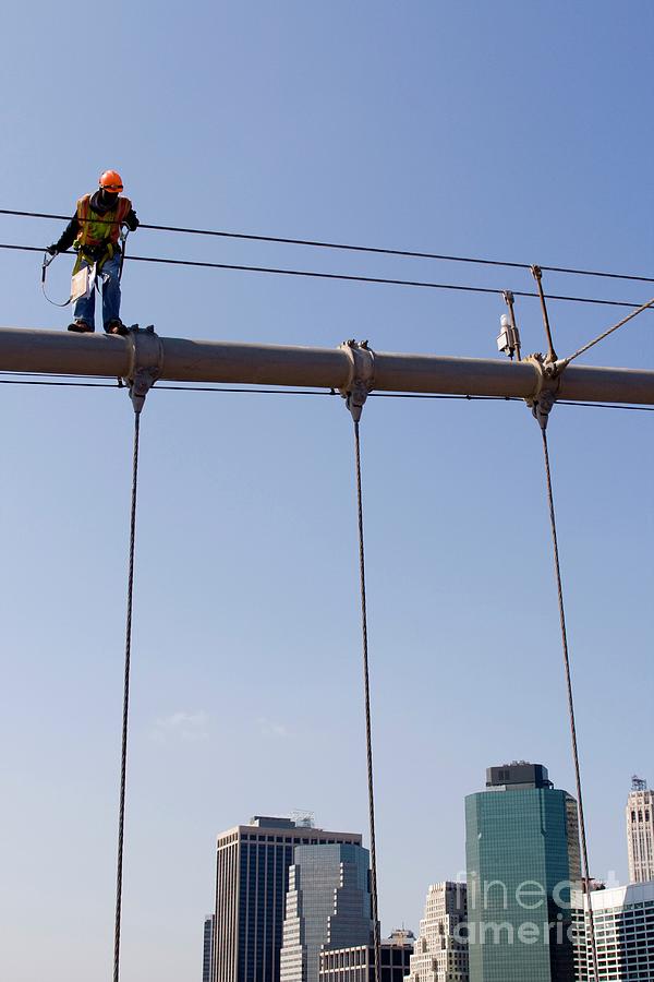 Worker On Top Of Brooklyn Bridge In New York City Photograph