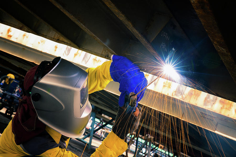 Worker Welding For Repair Bottom Side Of Container Box Photograph by Anek Suwannaphoom