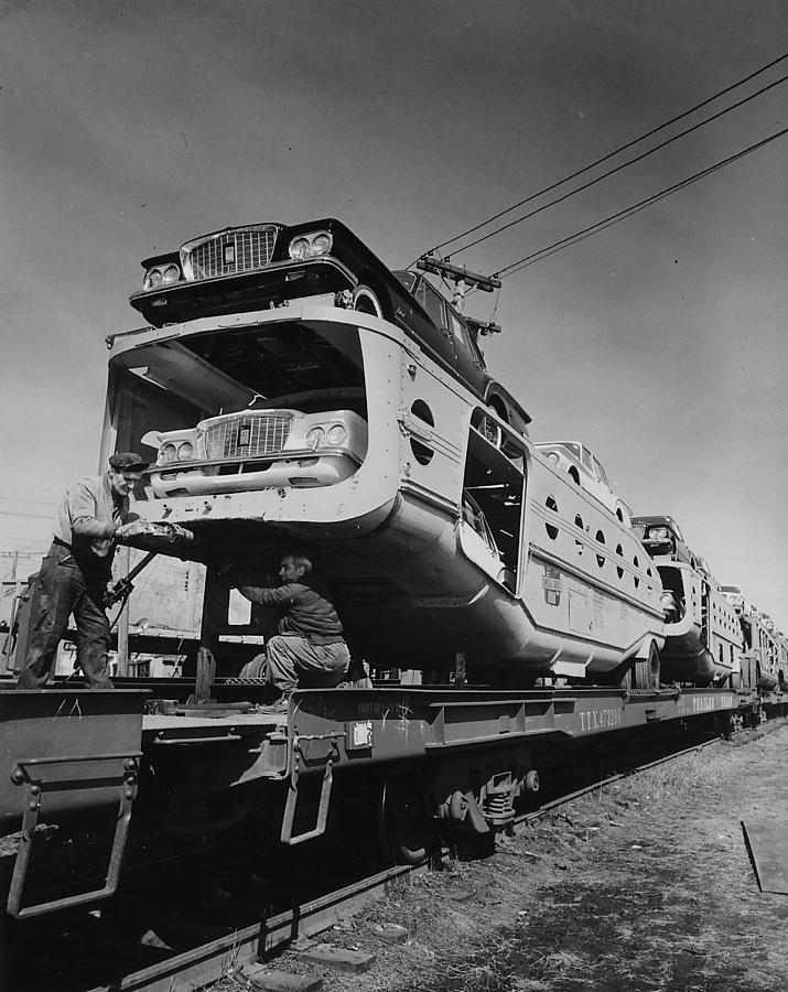 Workers Attach Automobile Carrier to Train Flatbed  Photograph by Chicago and North Western Historical Society