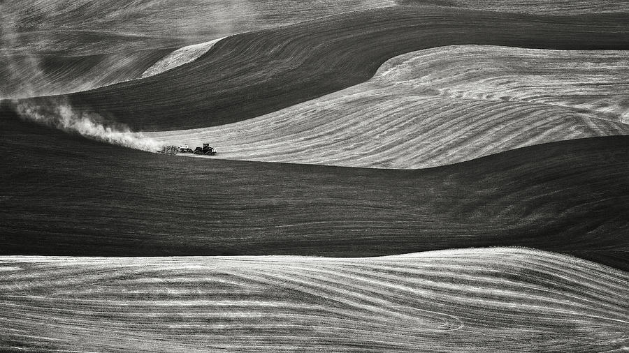 Working the fields in the Palouse black and white Photograph by Eduard Moldoveanu