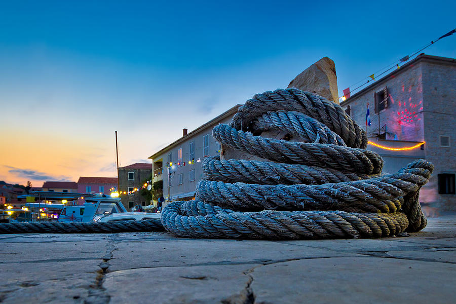 Wound boat rope on mooring bollard Photograph by Brch Photography