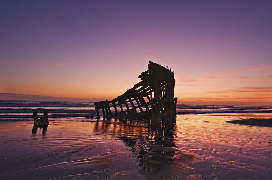 Wreck of the Peter Iredale on a Red sunset Photograph by John Christopher