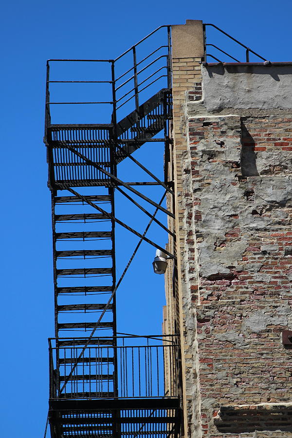 Wrought Iron Fire Escape on Old Worn Brick Building Chicago Photograph by Colleen Cornelius