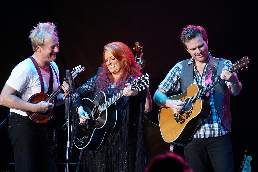 Wynonna Judd In Concert With Hubby Cactus Moser and Band Guitarist Photograph by Mick Anderson