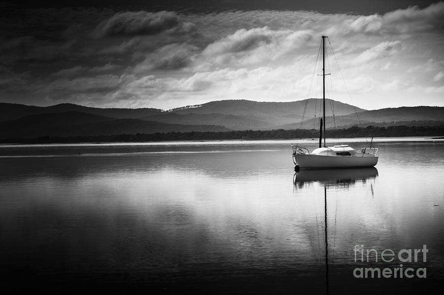 Yacht sailing boat with sails down in Port Sorell  Photograph by Jorgo Photography