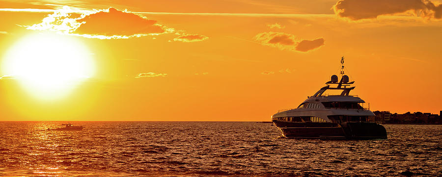 Yachtig on open sea at golden sunset panoramic view Photograph by Brch Photography