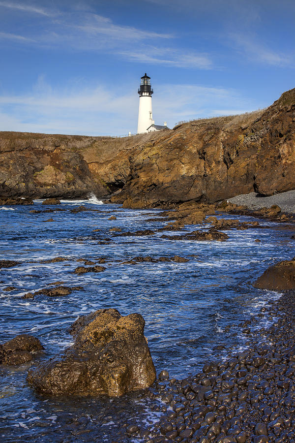 Yaquina Light and Rocks Photograph by Diana Powell