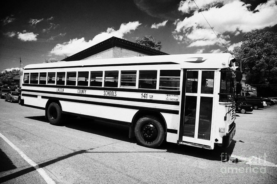 Bluebird Photograph - yellow american bluebird school bus in Lynchburg tennessee usa by Joe Fox