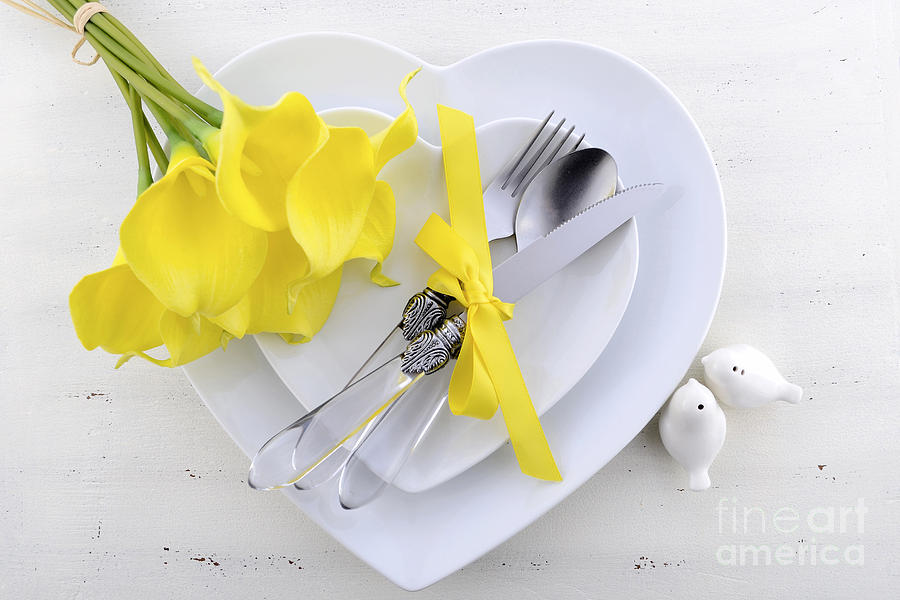 Yellow and white theme wedding table place setting.  Photograph by Milleflore Images