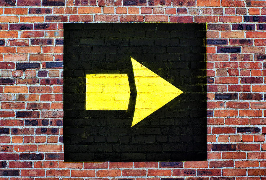 Yellow arrow - Right - Brick Wall Photograph by Nikolyn McDonald