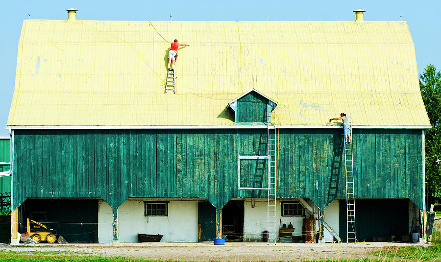 Yellow barn roof workers-1 Photograph by Steve Somerville