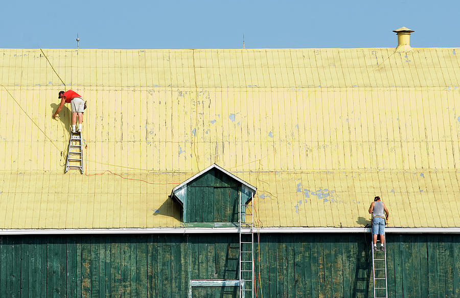 Yellow Barn Roof workers-3 Photograph by Steve Somerville