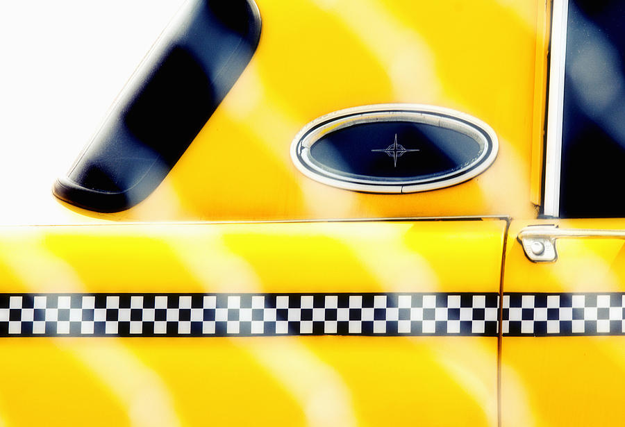 Checkers Photograph - Yellow Cab Behind the Fence by Emilio Lovisa