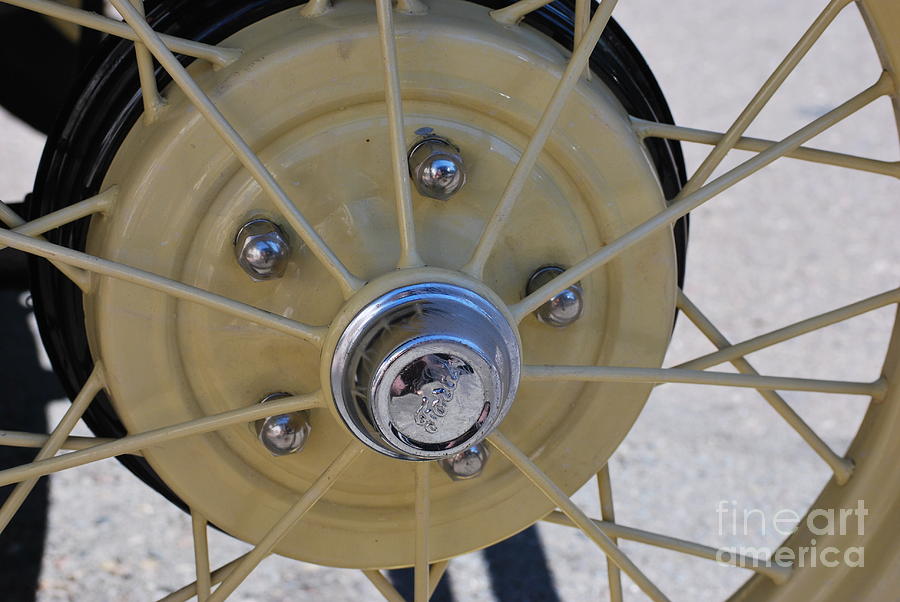 Yellow Ford Wheel Spokes Photograph by Heather Kirk