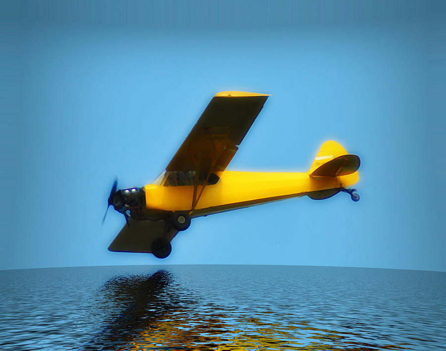 Yellow Plane Over the Sea Photograph by Bill Cannon