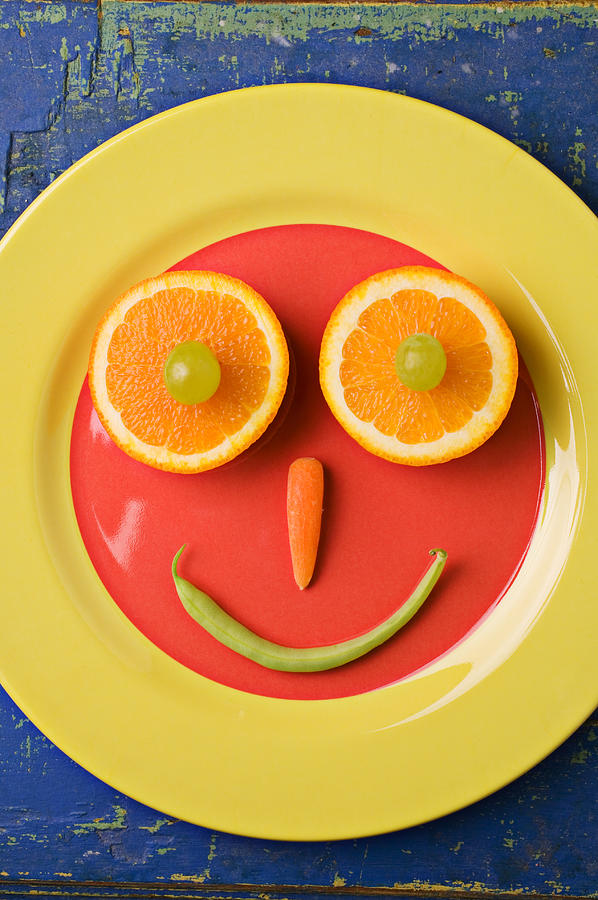 Grape Photograph - Yellow plate with food face by Garry Gay