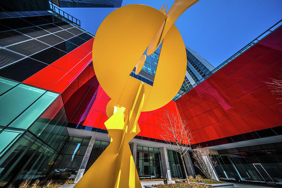 Yellow sculpture in front of Optima Chicago Center Pyrography by Judith Barath