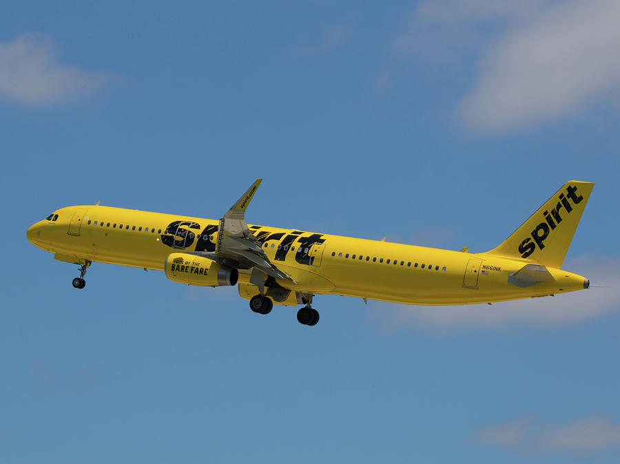 Yellow Spirit Airplane Takes Flight at FLL Photograph by Dart Humeston