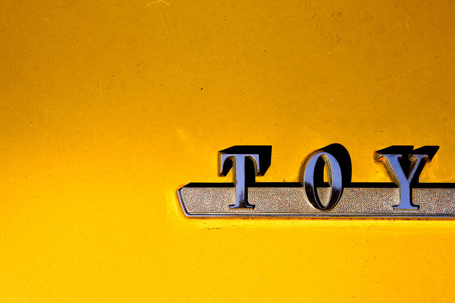Yellow Toy Photograph by Kreddible Trout
