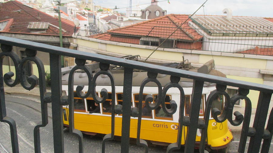 Tram Photograph - yellow tram in Lisbon by Anamarija Marinovic