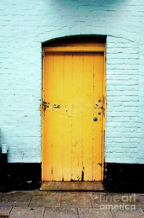 Yellow wooden door Photograph by Tom Gowanlock