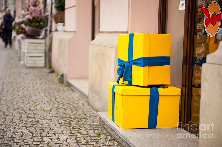 Yellow Xmas gifts with blue ribbon Photograph by Arletta Cwalina