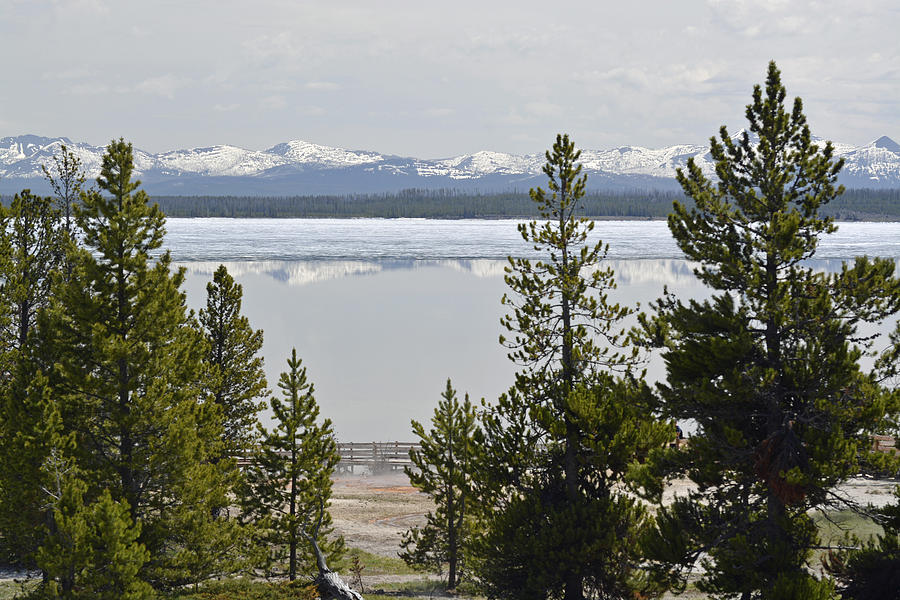 Yellowstone Lake Ice and Mountain Reflection Photograph by Bruce Gourley