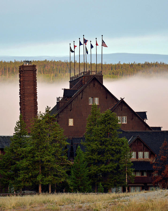 Yellowstones Old Faithful Inn with Morning Fog Photograph by Bruce Gourley