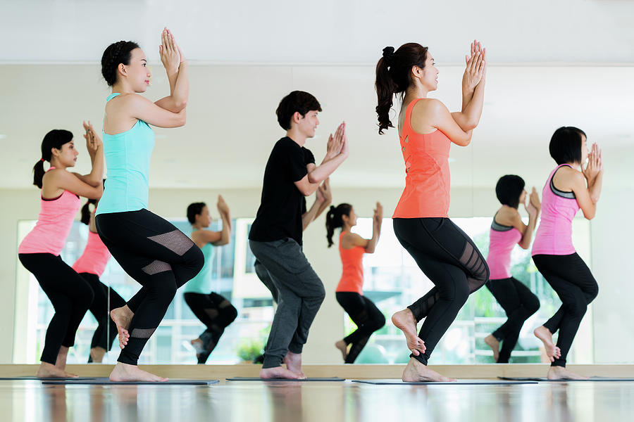 Yoga Group In Class Room In Fitness Center Photograph by Anek Suwannaphoom