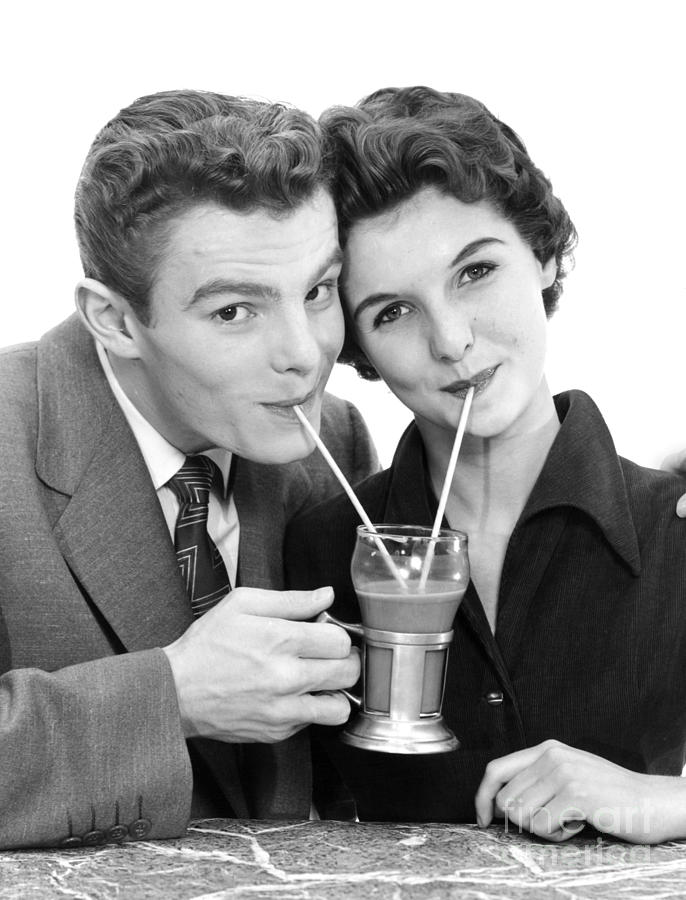 Young Couple Sharing A Milkshake Photograph by H. Armstrong Roberts/ClassicStock