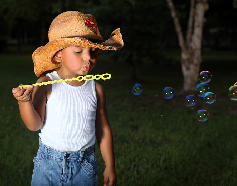 Young Cowboy Blowing Bubbles Photograph by Sheila Kay McIntyre