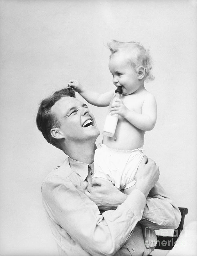 Young Father With Baby, 1930s Photograph by H. Armstrong Roberts/ClassicStock
