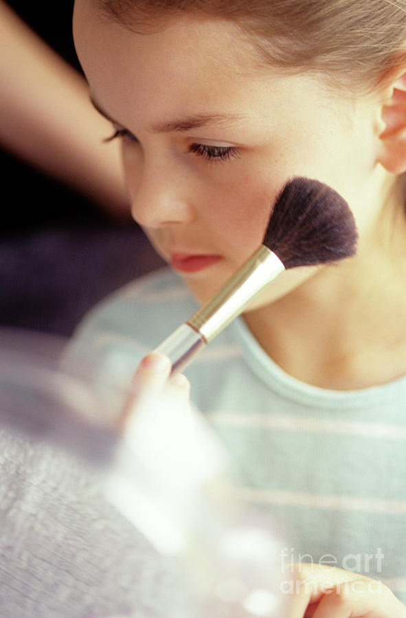Young Girl Applying Make Up Photograph by Jim Corwin
