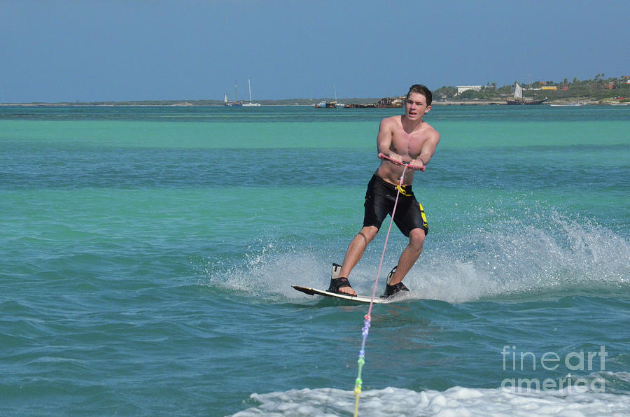 Young Guy Riding a Wakeboard Off the Coast of Aruba Photograph by DejaVu Designs