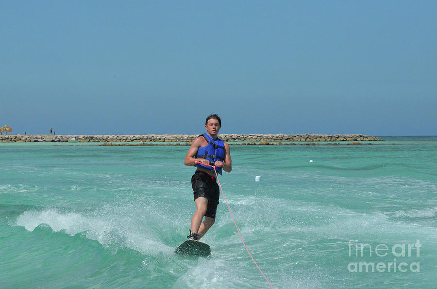 Young Guy Wakeboarder Standing Up Wakeboarding in Aruba Photograph by DejaVu Designs