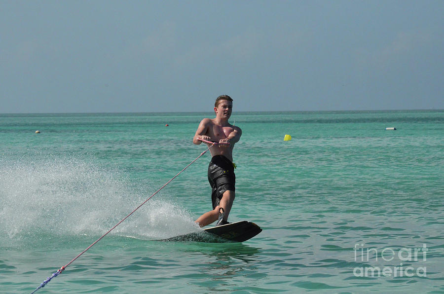 Young Guy Wakeboarding in the Tropical Blue Waters of Aruba Photograph by DejaVu Designs