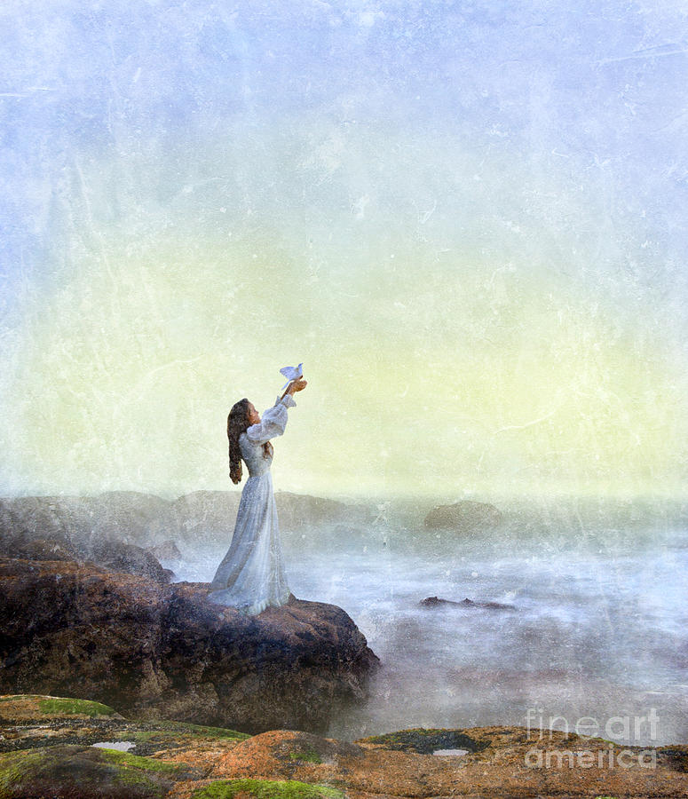 Dove Photograph - Young Lady Releasing a Dove by the Sea by Jill Battaglia