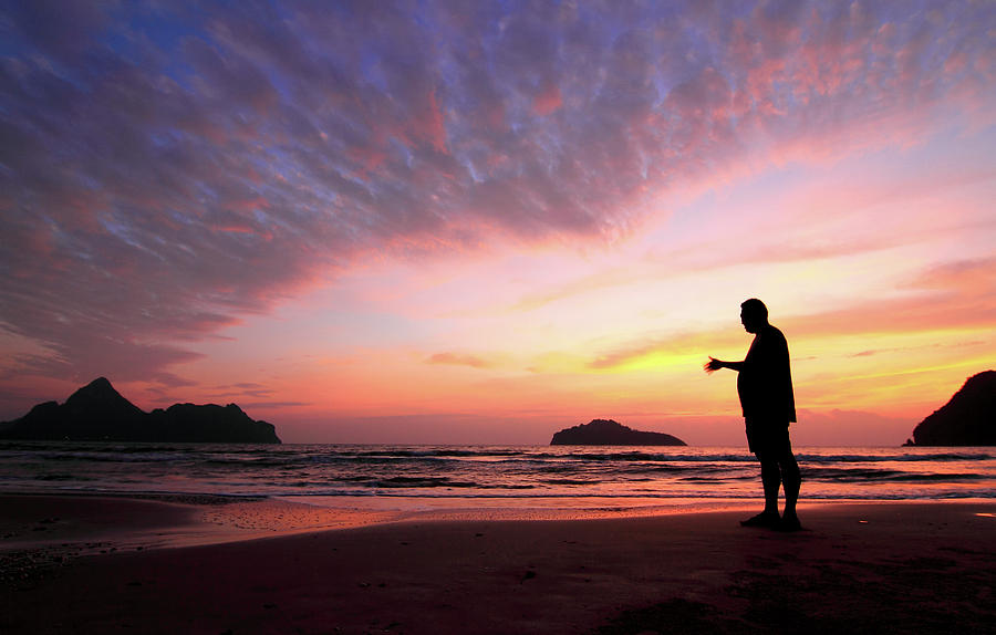 Young Man And Sunset  On Sea Photograph by Sujin Jetkasettakorn