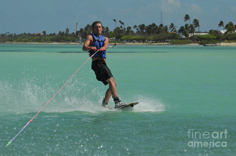 Young Man Wakeboarding in the Carribean Waters of Aruba Photograph by DejaVu Designs