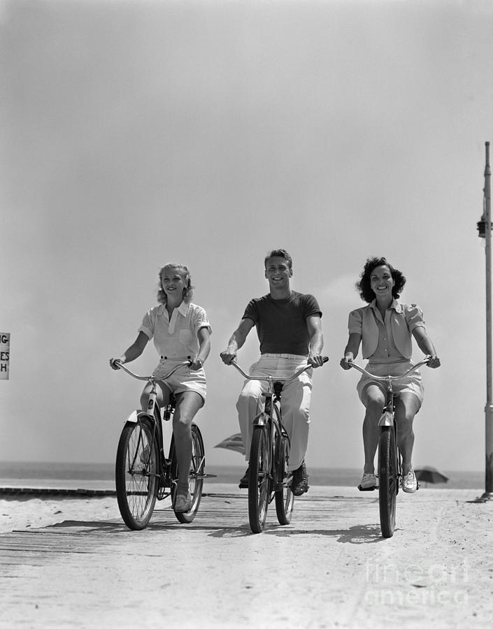 Young People Biking On The Beach Photograph by H Armstrong Roberts and ClassicStock