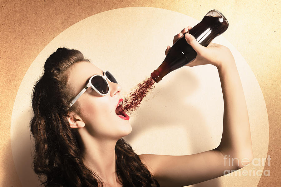 Young pinup woman in sunglasses drinking soda Photograph by Jorgo Photography
