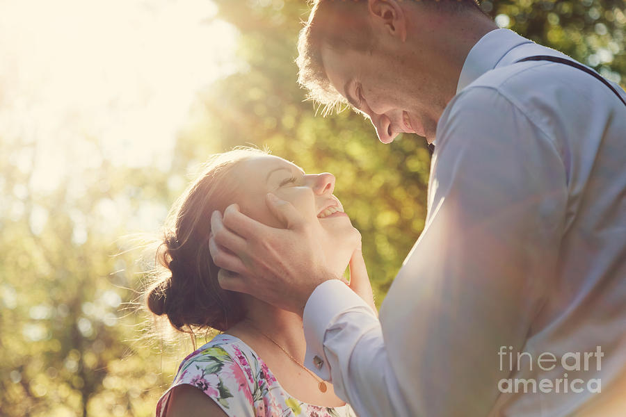 Young romantic couple flirting in sunshine Photograph by Michal Bednarek