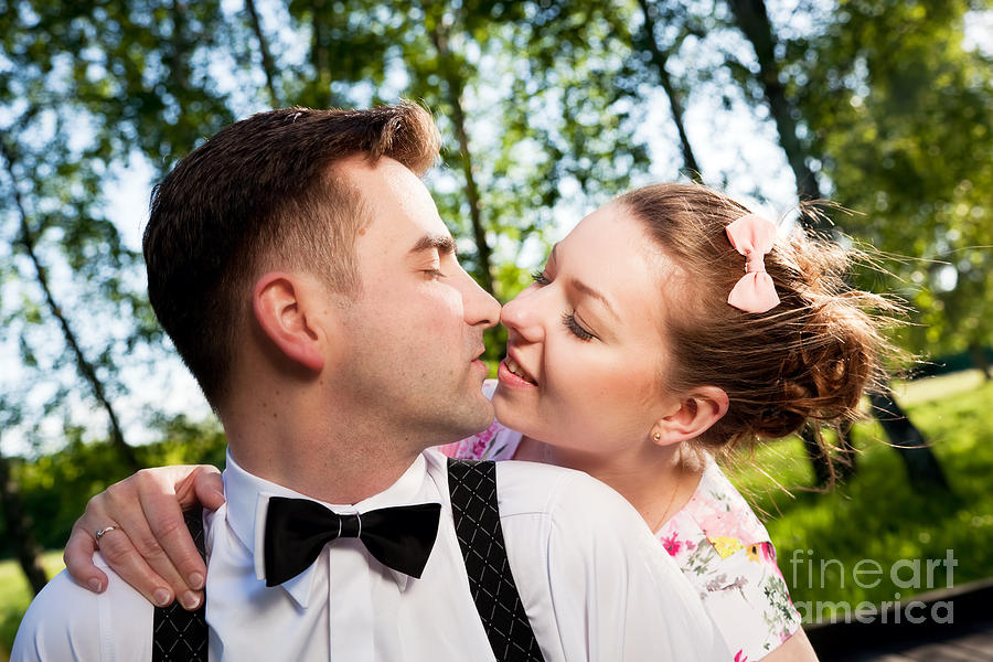Young romantic couple in love flirting in summer park Photograph by Michal Bednarek