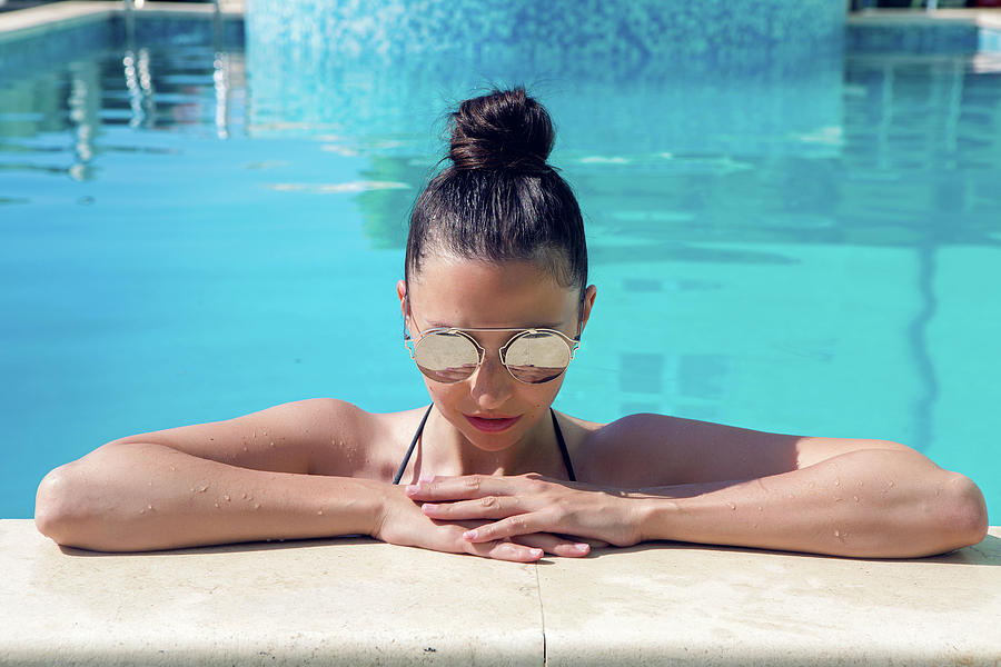 Young Sexy Girl In The Pool In Sunglasses Photograph