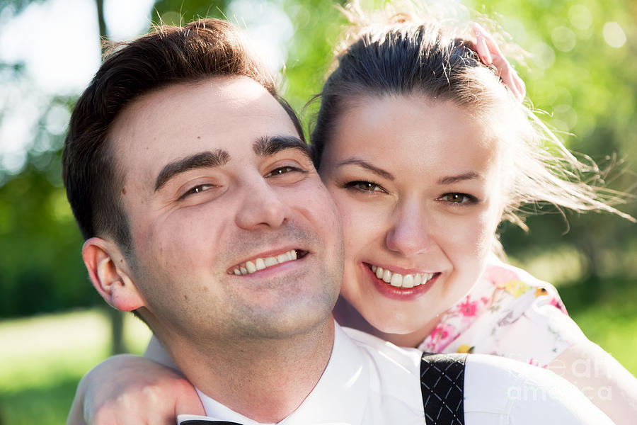 Young smiling couple in love portrait in summer park Photograph by Michal Bednarek
